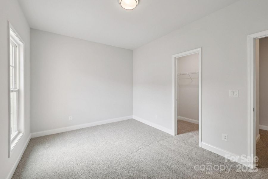 Spacious, unfurnished interior of a new home in Walk23, Huntersville (Image 25).