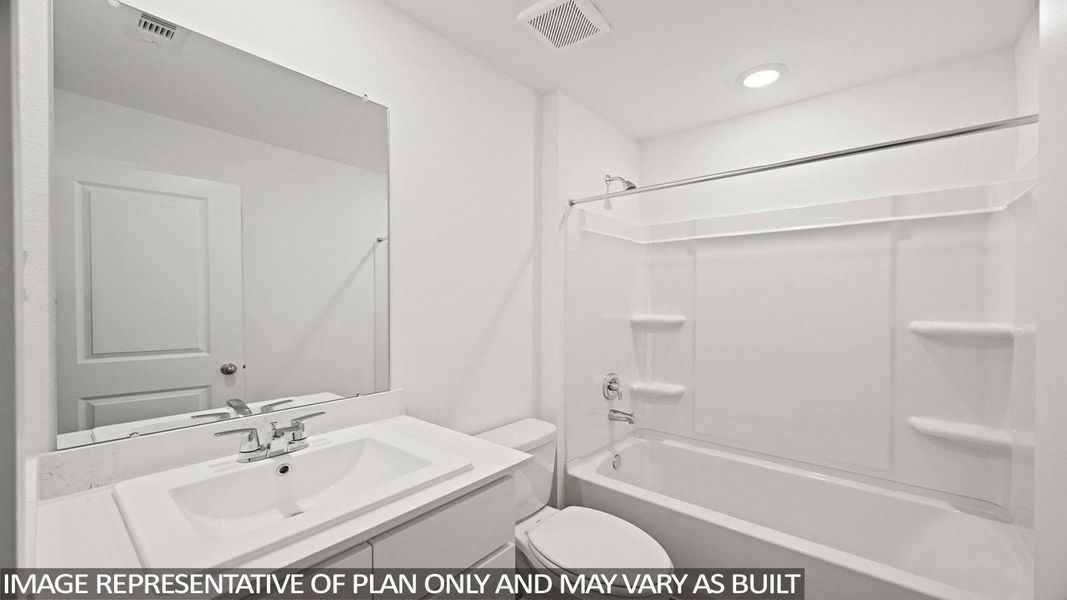 Bathroom featuring vanity and bathing tub / shower combination