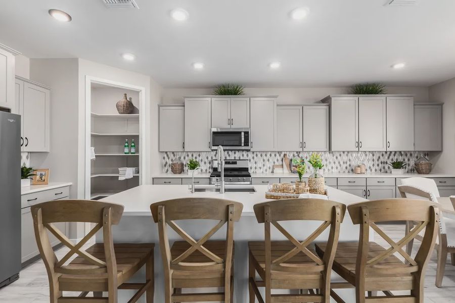 Representative furnished interior of a home built from the 2326 by Elliott Homes in Acacia at Santana, Yuma (Image 14).