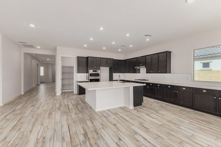Furnished interior view inside a new home in Valencia at Granite Vista, Waddell (Image 5).