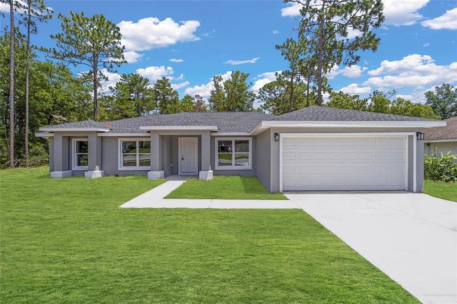 Front exterior of a new home in , Dunnellon, FL, highlighting curb appeal (Image 7).