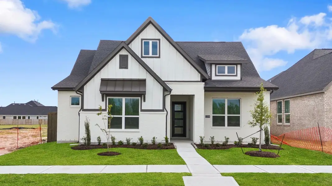 Front exterior of a new home in Riceland, Mont Belvieu, TX, highlighting curb appeal (Image 10).