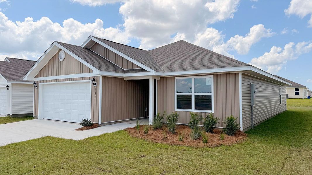 Front exterior of a new home in Liberty, Panama City, FL, highlighting curb appeal (Image 2). Front exterior of a new home in Liberty, Panama City, FL, highlighting curb appeal (Image 2).
