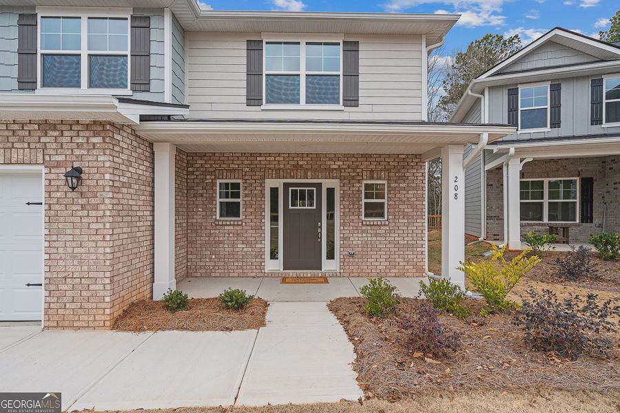 Exterior details and patio area of a home in Canterbury Villas, Carrollton (Image 3).