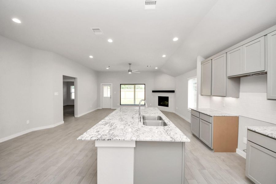 This generously spacious kitchen is a dream realized! Sample photo of completed home with similar floor plan. Actual colors and selections may vary. This generously spacious kitchen is a dream realized! Sample photo of completed home with similar floor plan. Actual colors and selections may vary.