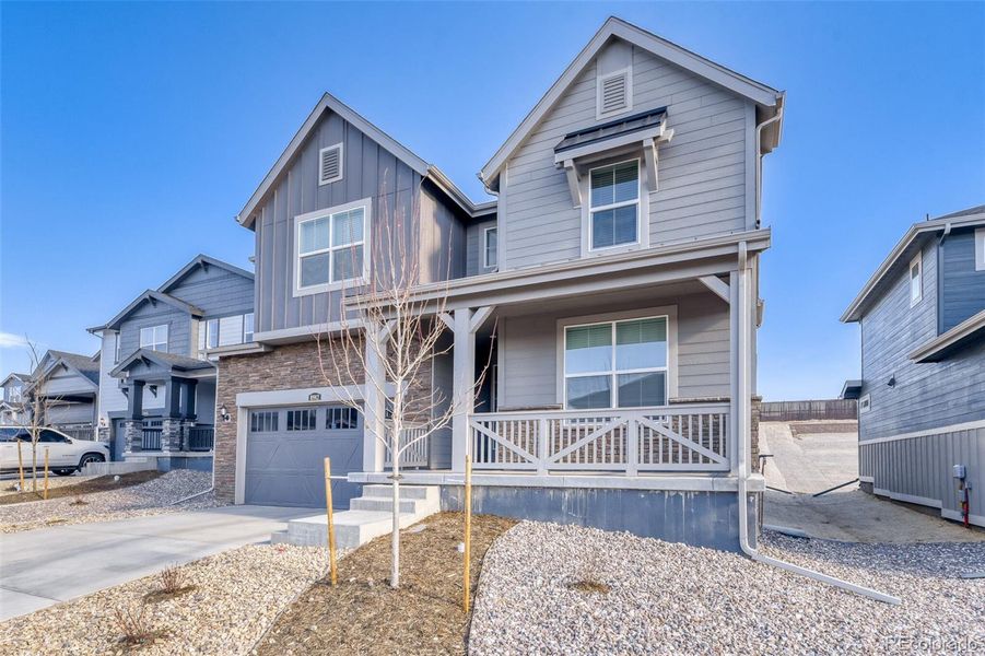 Front exterior of a new home in Newlin Crossing, Parker, CO, highlighting curb appeal (Image 2).