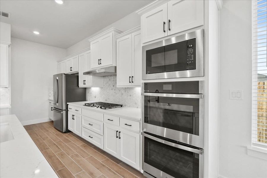 Furnished interior view inside a new home in Village at Three Oaks, Seguin (Image 11). Furnished interior view inside a new home in Village at Three Oaks, Seguin (Image 11).