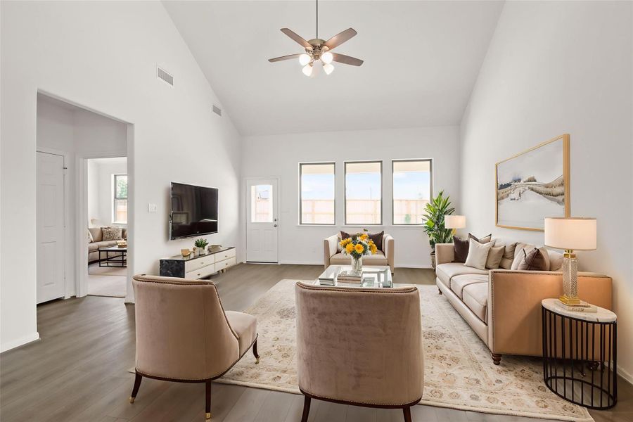 Your family room has ample space to entertain family and friends. This space features beautiful floors, fresh paint, ceiling fan with lighting, and high ceilings. Your family room has ample space to entertain family and friends. This space features beautiful floors, fresh paint, ceiling fan with lighting, and high ceilings.