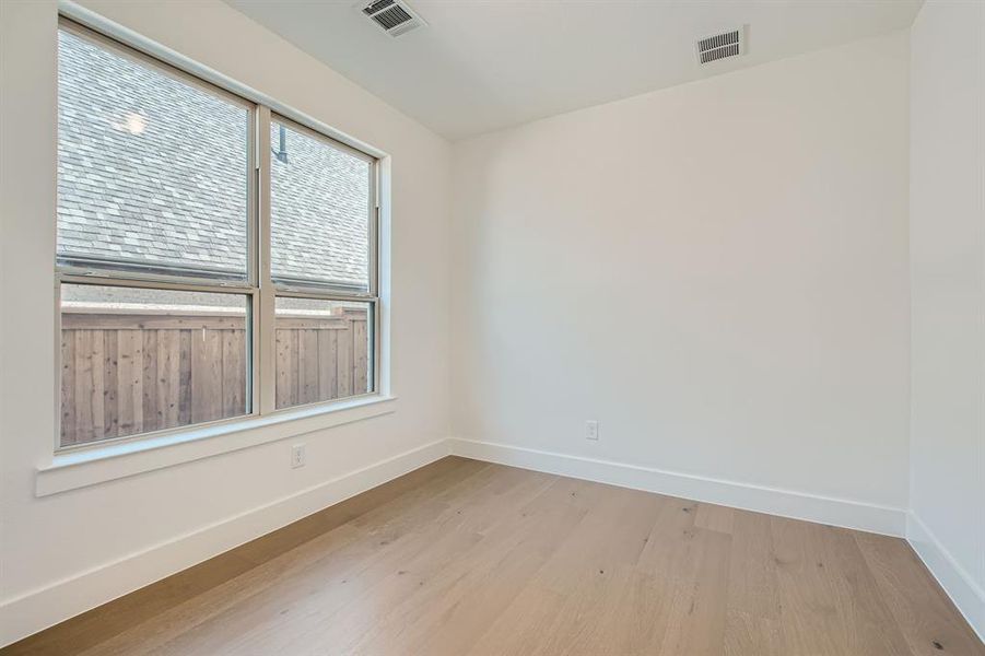 Empty room with light wood-type flooring