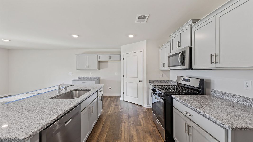 Furnished interior view inside a new home in Bentley Park, Greenwood (Image 9).