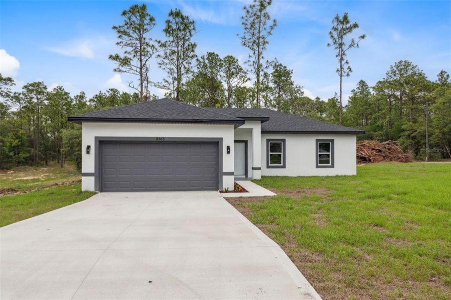 Front exterior of a new home in , Citrus Springs, FL, highlighting curb appeal (Image 20).