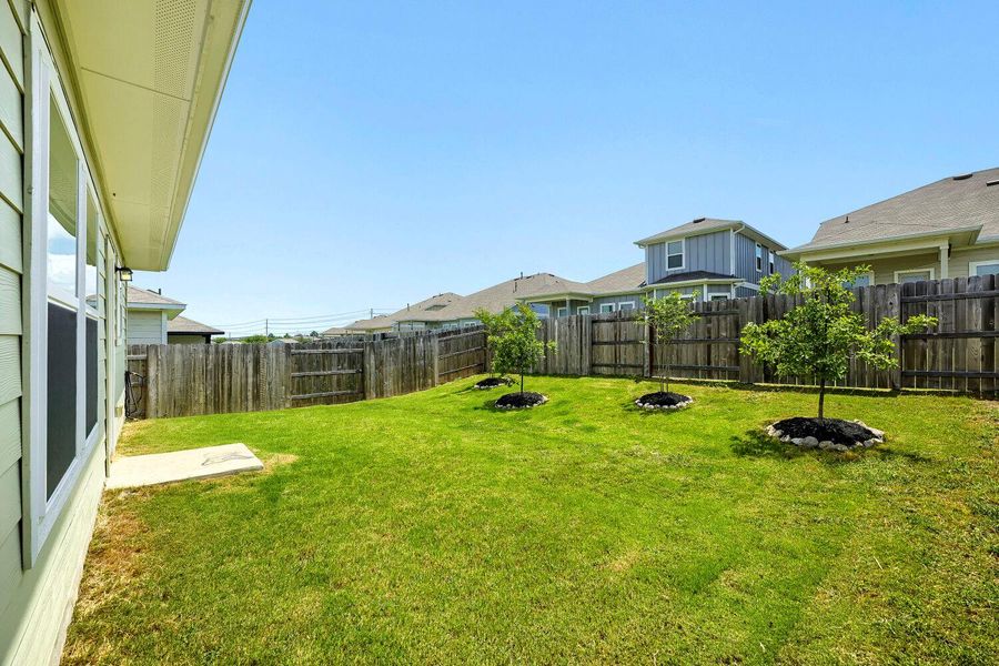 A well-maintained lawn offers ample space for outdoor activities and relaxation. A well-maintained lawn offers ample space for outdoor activities and relaxation.