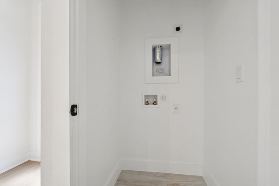 Spacious, unfurnished interior of a new home in Koenig Townhomes, Austin (Image 32).