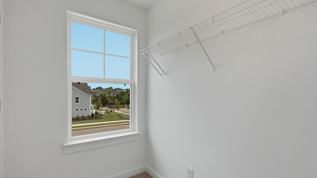 Secondary Bedroom Walk-in Closet with window