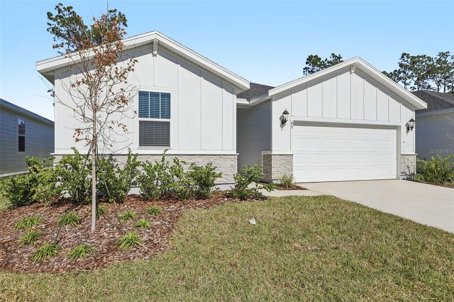 Front exterior of a new home in , Palm Coast, FL, highlighting curb appeal (Image 19).