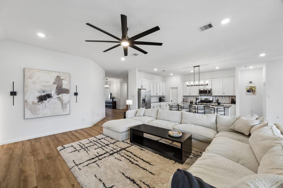 The highly desirable floor plan brings the heart of the home together. Note the upgraded fan, light fixtures, door and cabinet hardware. The highly desirable floor plan brings the heart of the home together. Note the upgraded fan, light fixtures, door and cabinet hardware.