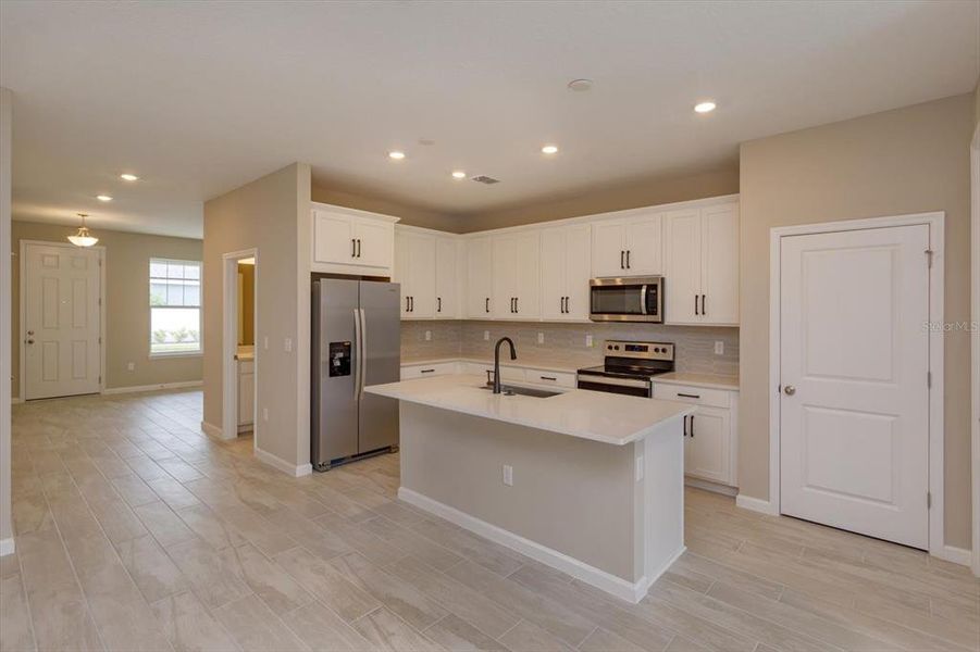 Furnished interior view inside a new home in Serenade at Ovation, Winter Garden (Image 6).