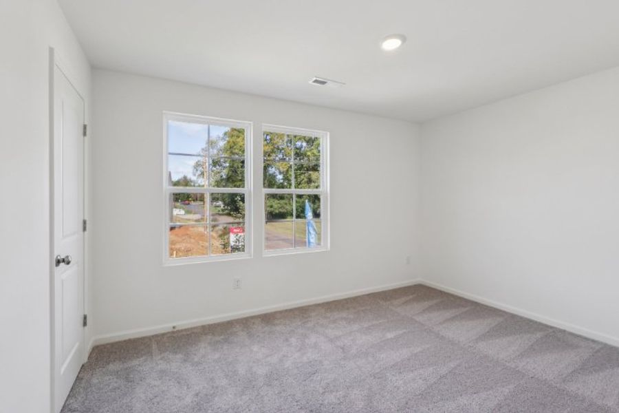 A room with a window and a door.
