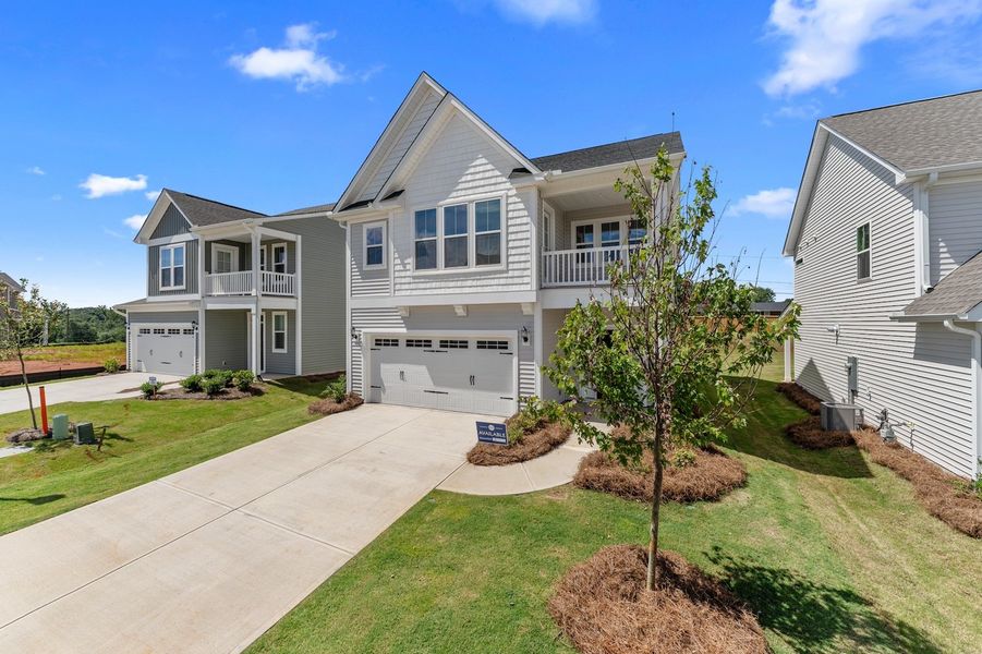 Front exterior of a new home in Landmark Commons, Boiling Springs, SC, highlighting curb appeal (Image 2). Front exterior of a new home in Landmark Commons, Boiling Springs, SC, highlighting curb appeal (Image 2).