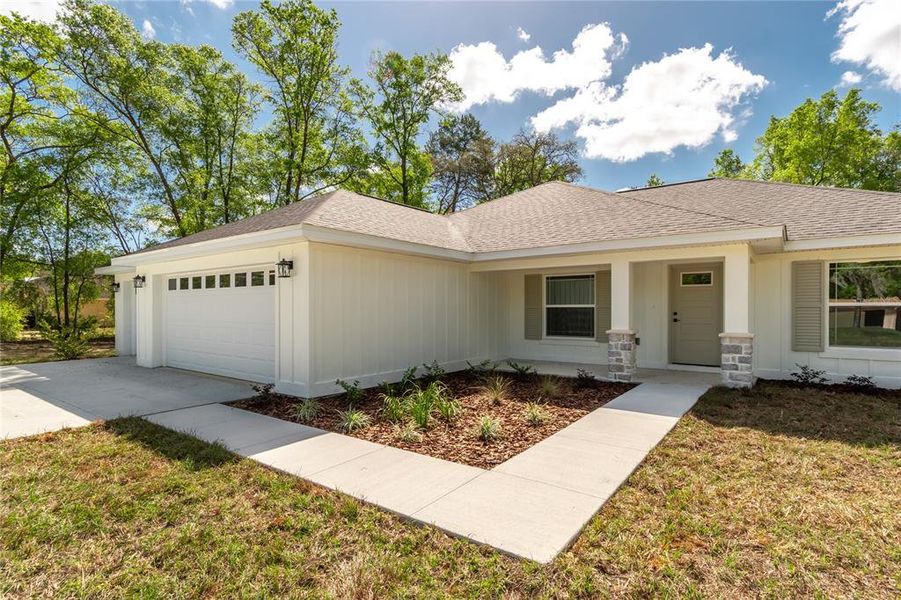 Front exterior of a new home in , Ocala, FL, highlighting curb appeal (Image 26).