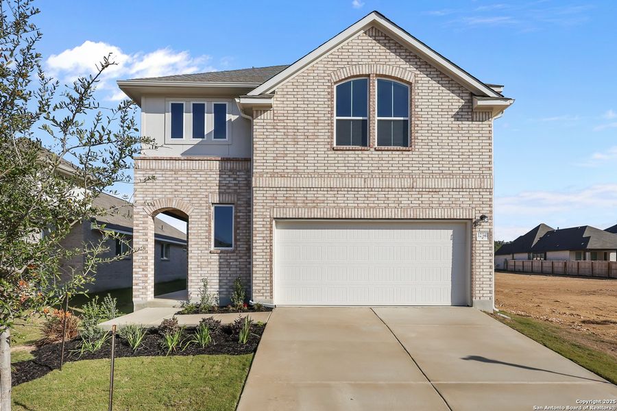 Front exterior of a new home in Davis Ranch, San Antonio, TX, highlighting curb appeal (Image 18).