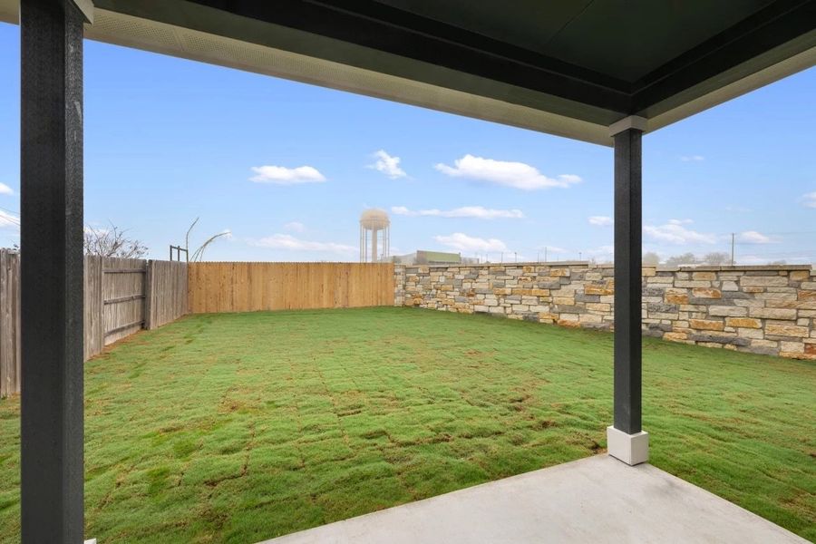 Exterior details and patio area of a home in Covered Bridge, Hutto (Image 4).