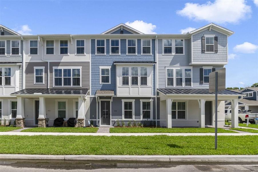 Front exterior of a new home in Vdara, Orlando, FL, highlighting curb appeal (Image 1).