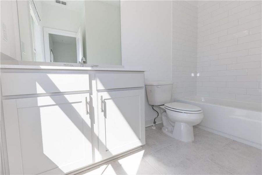 Secondary bathroom on the top level*Photo of model home in a different community. Used for illustrative purposes only*