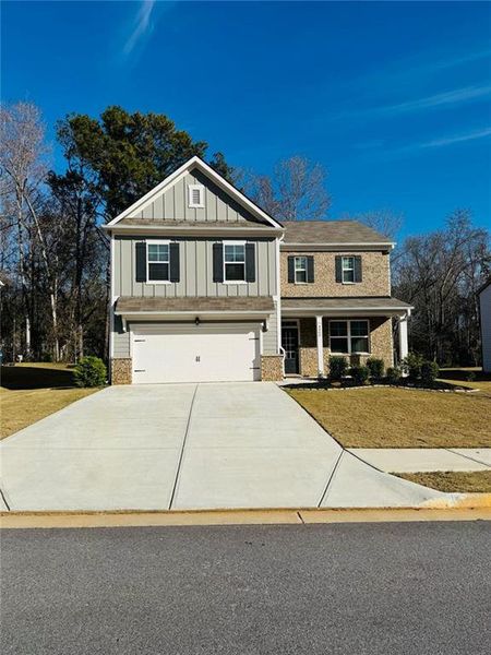 Front exterior of a new home in , Powder Springs, GA, highlighting curb appeal (Image 2). Front exterior of a new home in , Powder Springs, GA, highlighting curb appeal (Image 2).