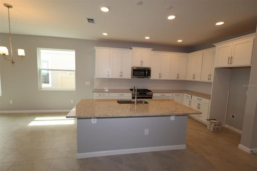 Furnished interior view inside a new home in Center Lake on the Park, St. Cloud (Image 7).