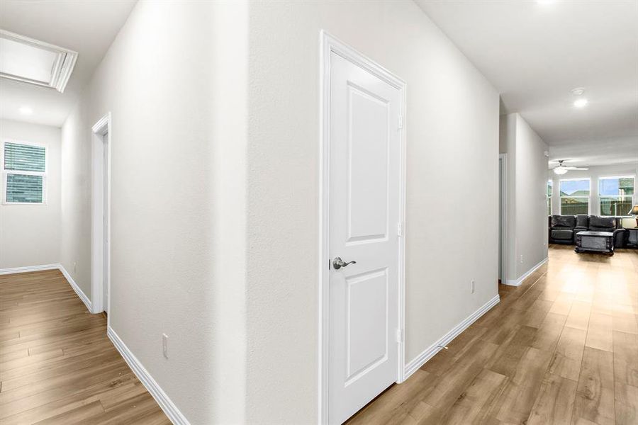 Hallway featuring light wood-style floors and recessed lighting Hallway featuring light wood-style floors and recessed lighting