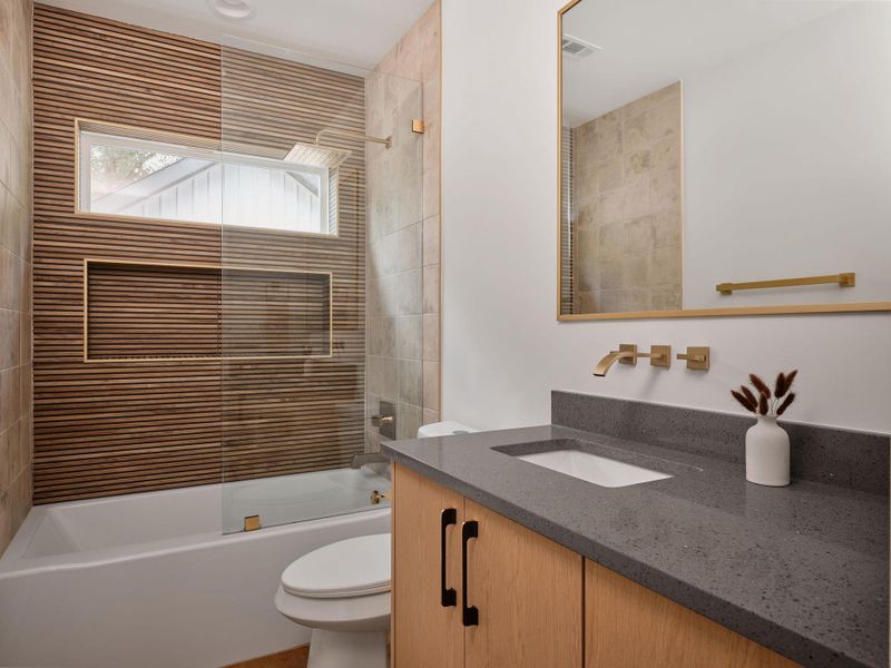 Bathroom with bath / shower combo with glass door and vanity Bathroom with bath / shower combo with glass door and vanity