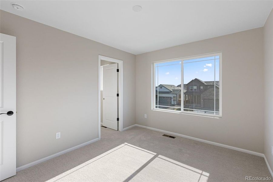 Spacious, unfurnished interior of a new home in The Cottages Collection at Ridgeline Vista, Brighton (Image 27).