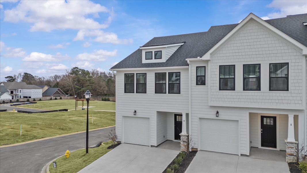 Front exterior of a new home in Gresham Station, Simpsonville, SC, highlighting curb appeal (Image 20).