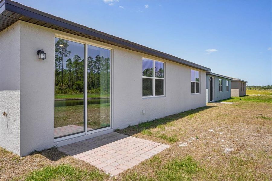 Front exterior of a new home in Lake Deer Estates - Signature Series, Poinciana, FL, highlighting curb appeal (Image 2). Front exterior of a new home in Lake Deer Estates - Signature Series, Poinciana, FL, highlighting curb appeal (Image 2).