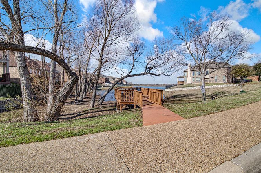 Surrounding community with a deck with water view