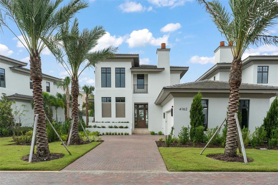 Front exterior of a new home in , Orlando, FL, highlighting curb appeal (Image 1). Front exterior of a new home in , Orlando, FL, highlighting curb appeal (Image 1).