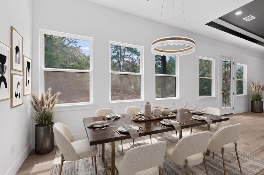 Natural light floods this inviting dining space, ideal for memorable gatherings.