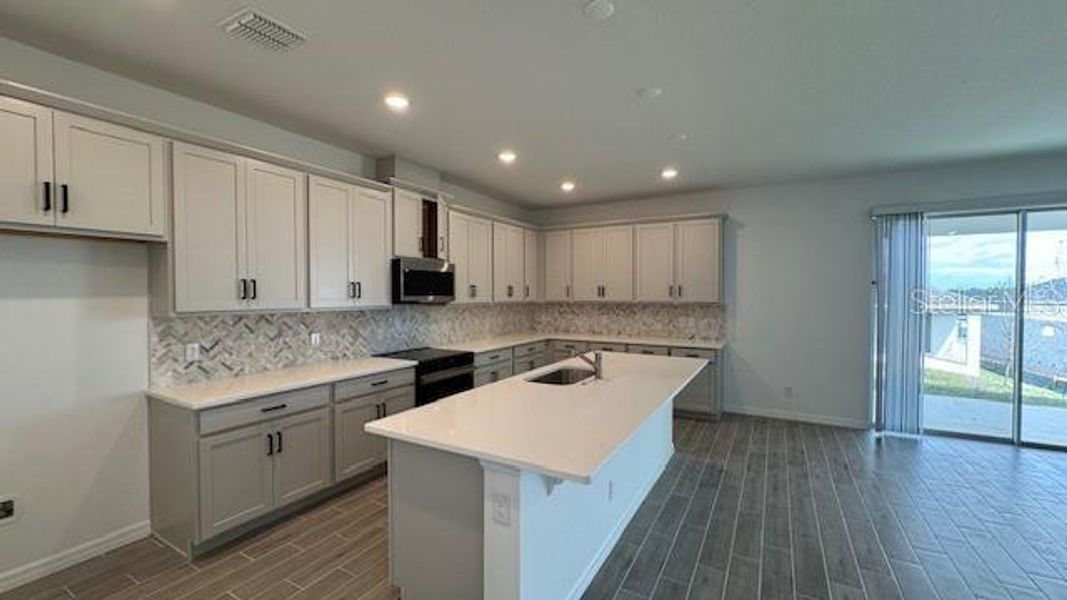 Furnished interior view inside a new home in Cypress Bluff, Groveland (Image 8).