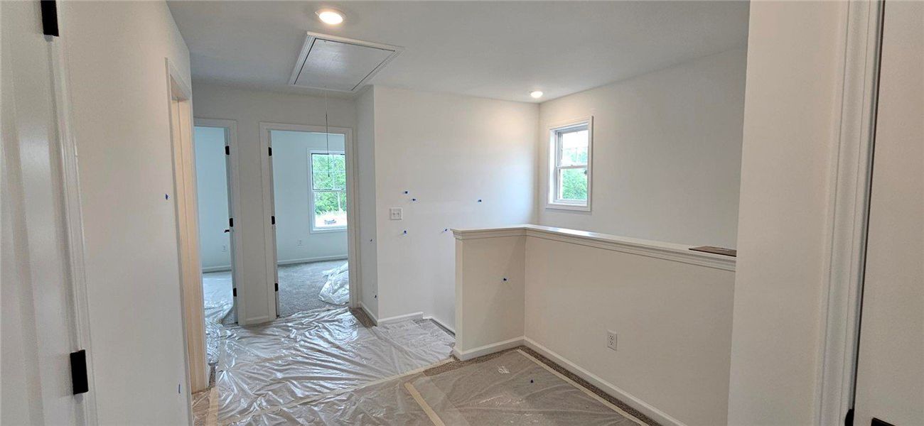 This spacious hallway offers natural light, creati This spacious hallway offers natural light, creati