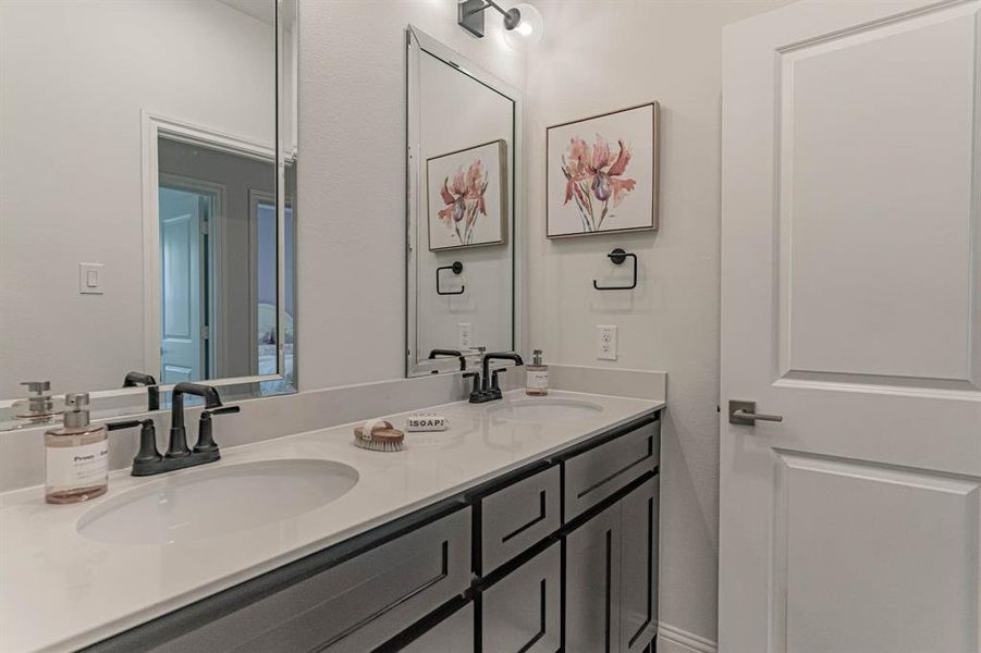 Third and fourth bedroom share this dual vanity bath with separate shower room Third and fourth bedroom share this dual vanity bath with separate shower room