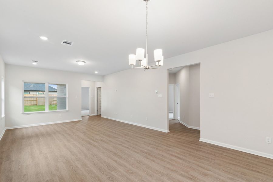 The Oakshire II- Family Room into Secondary Bedrooms Hallway.  Sample image for illustration; upgrades, options, and colors may vary.
