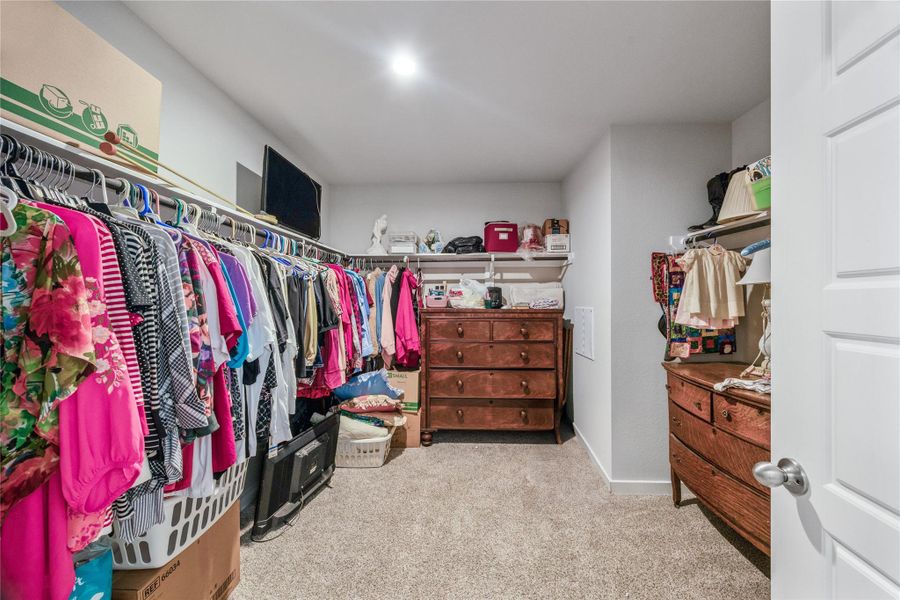 extremely spacious primary closet.