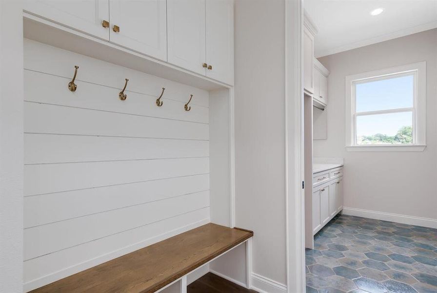 Mudroom with baseboards and ornamental molding Mudroom with baseboards and ornamental molding