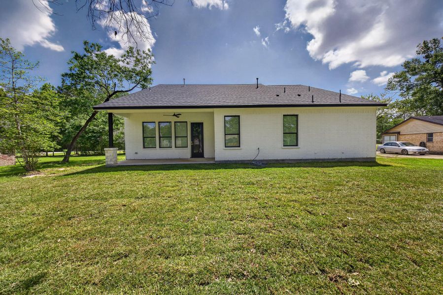Exterior details and patio area of a home in , New Caney (Image 27).