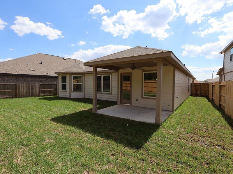 Exterior details and patio area of a home in Pinewood at Grand Texas, New Caney (Image 18).