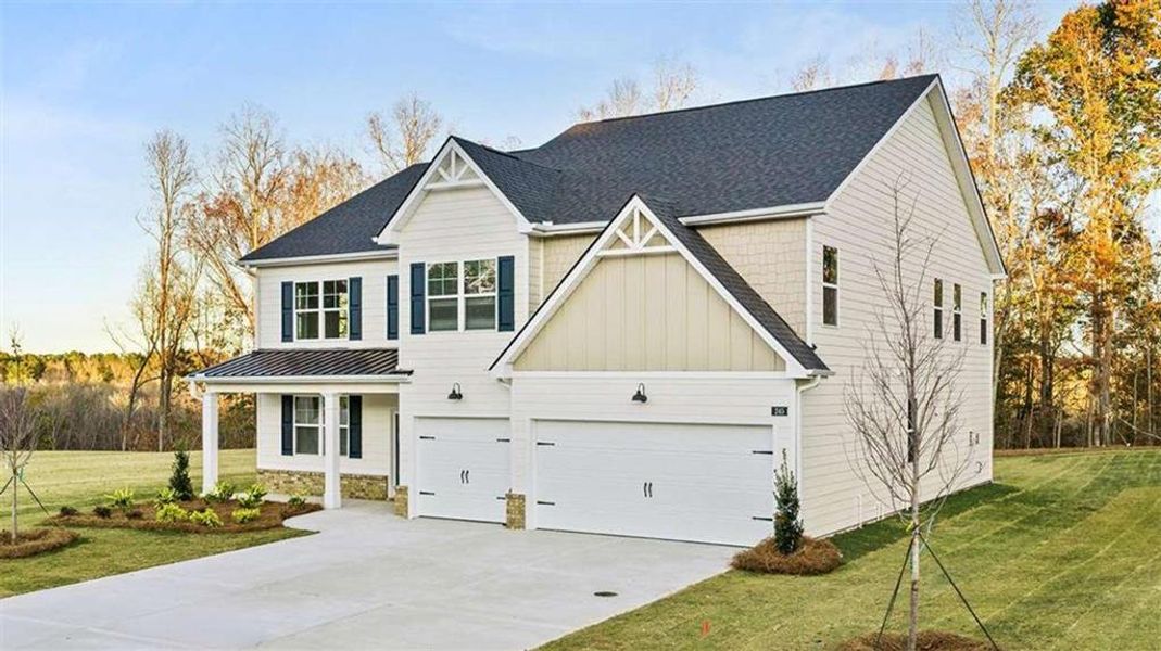 Front exterior of a new home in Heritage Pointe, Senoia, GA, highlighting curb appeal (Image 2). Front exterior of a new home in Heritage Pointe, Senoia, GA, highlighting curb appeal (Image 2).