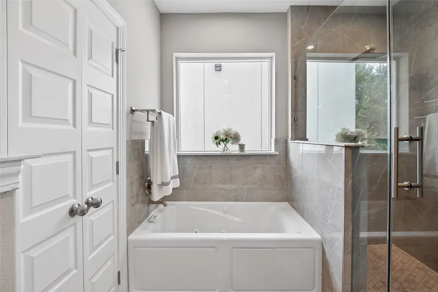 Primary Closet with Standing shower and jetted tub Primary Closet with Standing shower and jetted tub