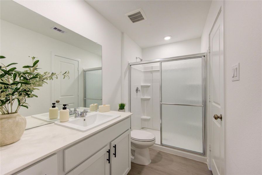 Primary bathroom with practical layout and privacy
