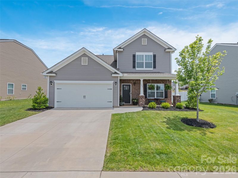 Front exterior of a new home in , Fletcher, NC, highlighting curb appeal (Image 1). Front exterior of a new home in , Fletcher, NC, highlighting curb appeal (Image 1).